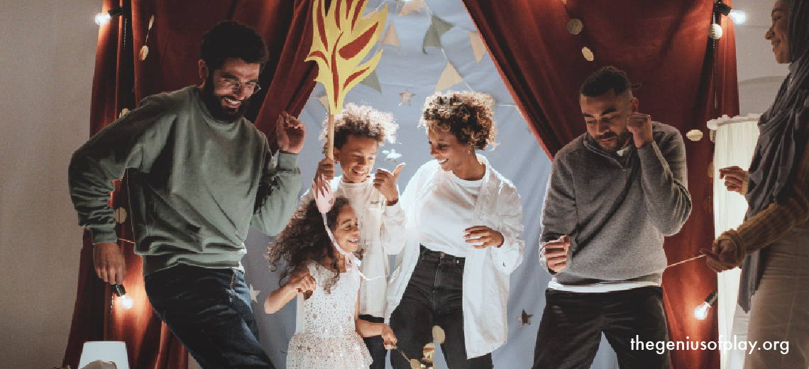 ethnically diverse family and children dancing on a stage in a pretend play 