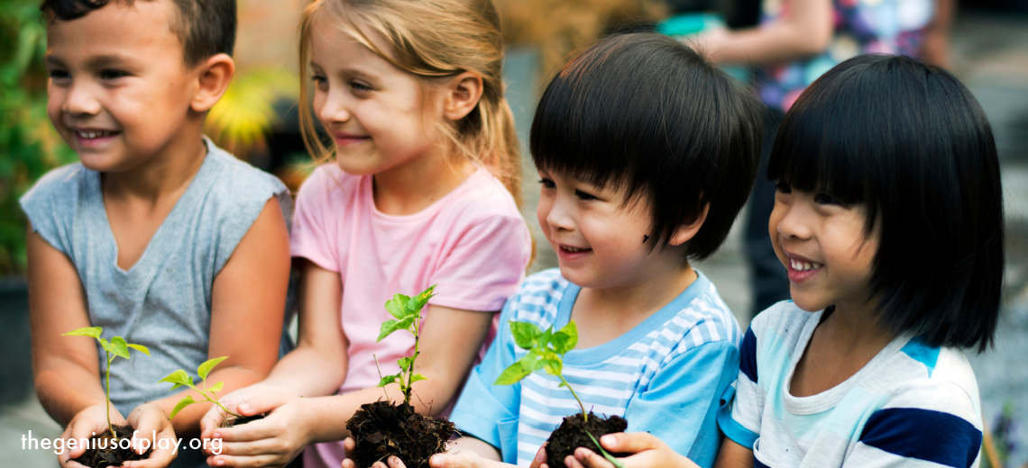 Group of multi-cultural diverse kids holding plants outdoors