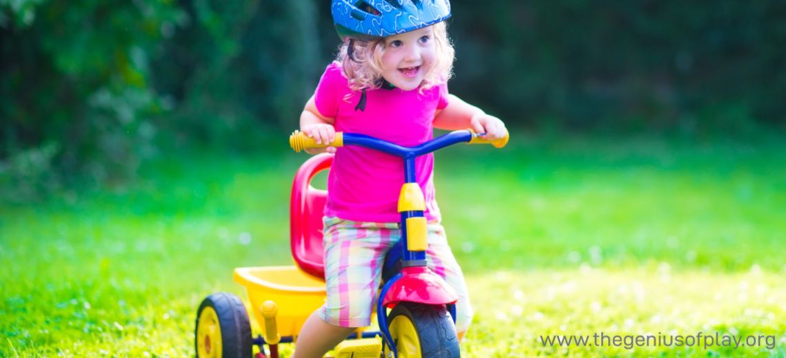 toddler daughter riding a tricycle