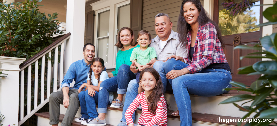 multi-generational family sitting on a home porch steps