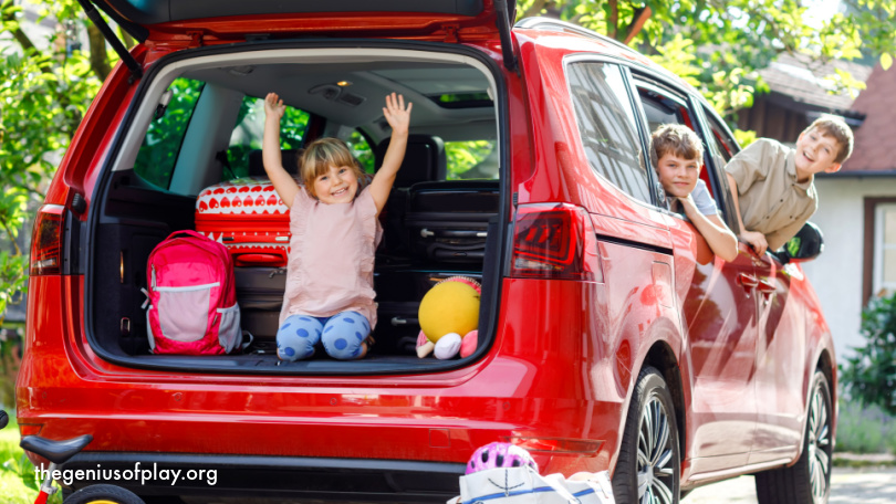 Happy siblings, brothers and sister with suitcases and toys sitting in their family car getting ready for a road trip