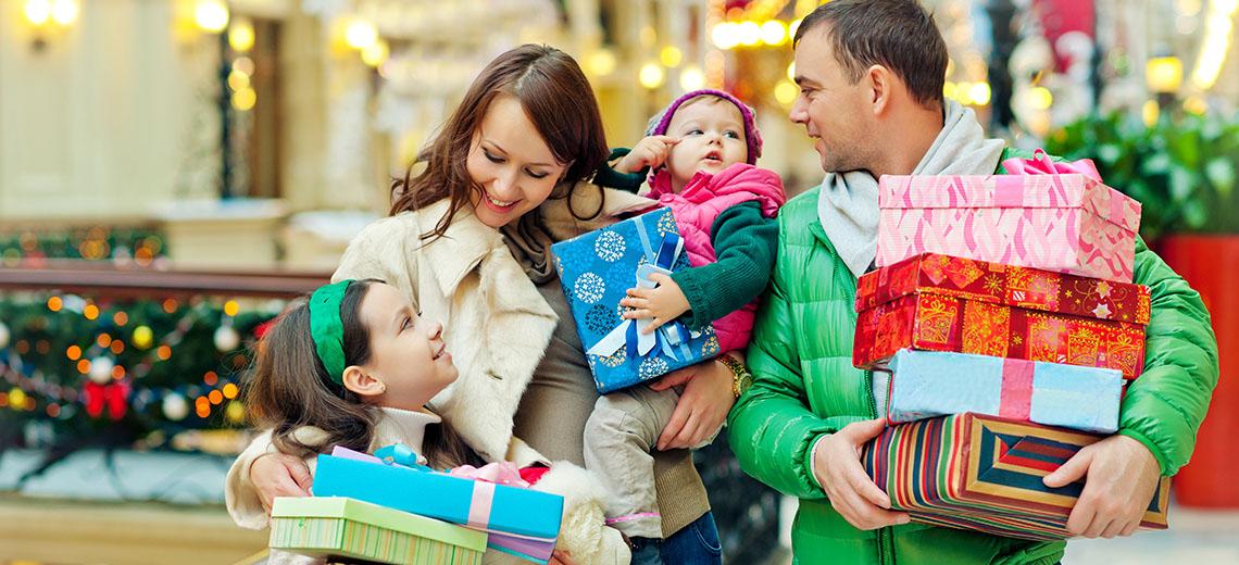 two young children smiling as festive confetti falls down around them